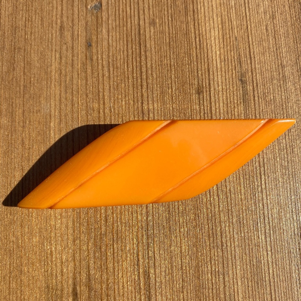 Orange Bakelite brooch